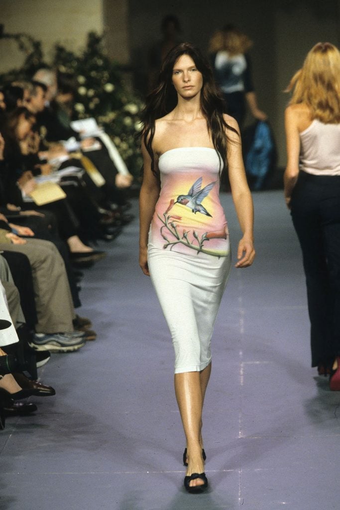 Model wearing a strapless hummingbird-print dress from Stella McCartney's Chloé Spring 1999 collection on the runway.