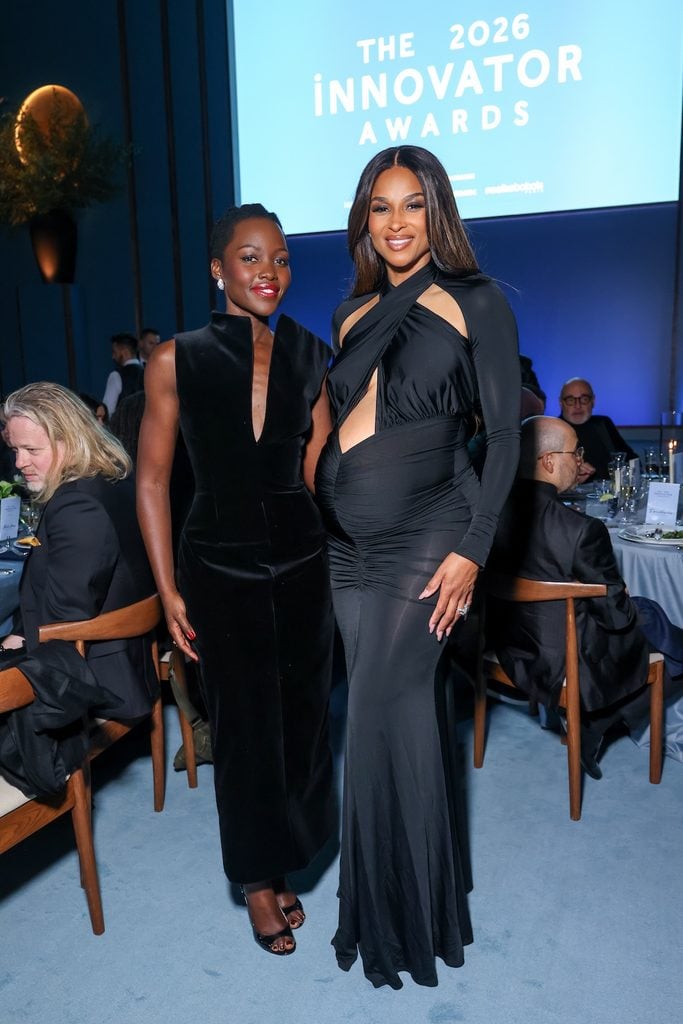 Lupita Nyong'o and Ciara wearing a black LaPointe cut-out gown with a twisted halterneck and ruched waist at the 2026 WSJ. Magazine Innovator Awards.