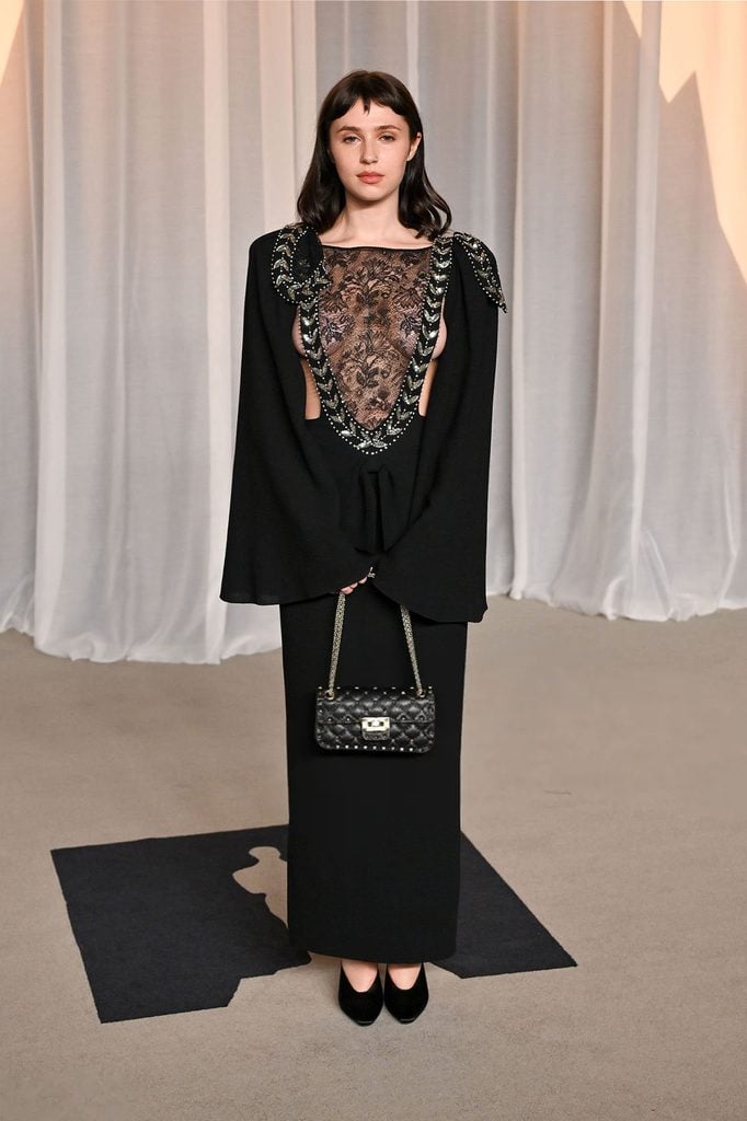 Clairo wearing a black Valentino Fall 2026 dress with an embroidered lace bodice at the 2026 Academy Museum Gala in Los Angeles