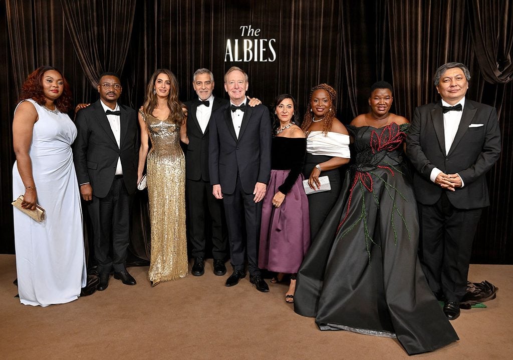 Amal and George Clooney with fellow guests and honourees at the Clooney Foundation for Justice's 2026 Albies in London.