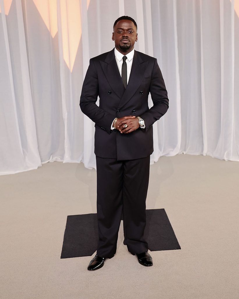 Daniel Kaluuya wearing a midnight-blue Giorgio Armani double-breasted suit and dark tie at the 2026 Academy Museum Gala