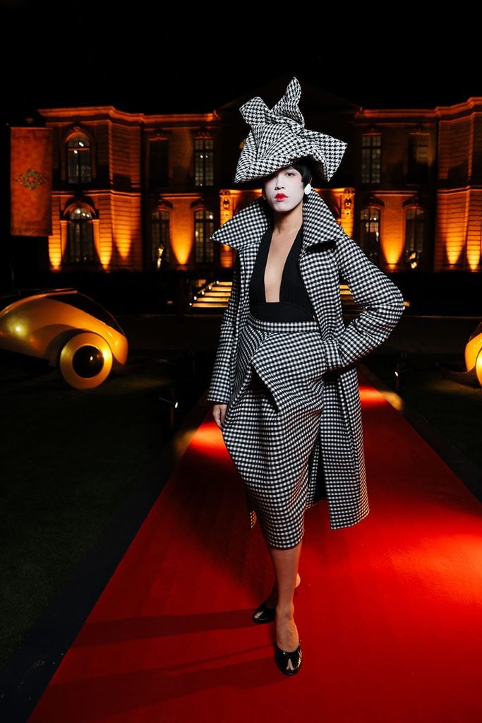 Dara Allen wearing a houndstooth McQueen look while hosting the Hunger Games Elegance Is Authority event in Paris.