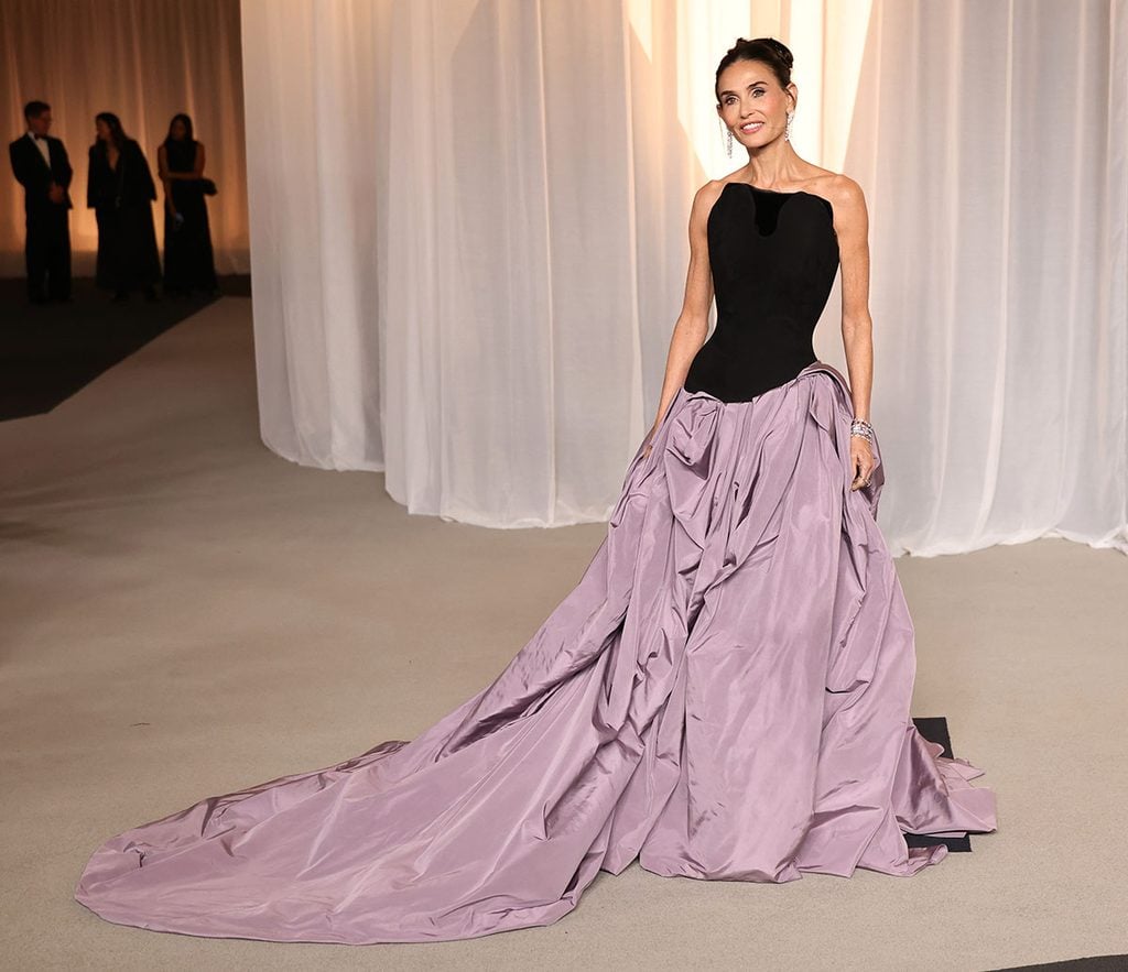 Demi Moore wearing a black and dusty lavender Standing Ground Fall 2026 strapless gown at the Academy Museum Gala in Los Angeles