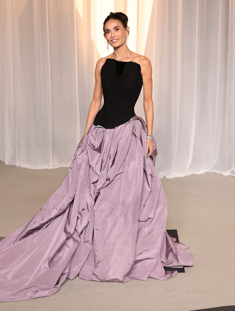 Demi Moore wearing a sculptural black and lavender Standing Ground gown at the 2026 Academy Museum Gala in Los Angeles