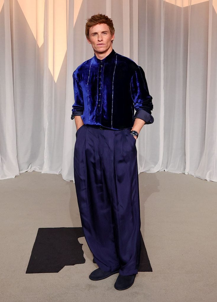 Eddie Redmayne wearing a cobalt-blue velvet Giorgio Armani Fall 2026 look at the Academy Museum Gala in Los Angeles