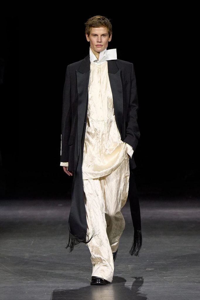 Erdem Spring 2027 ready-to-wear runway look featuring the black fringed jacket and ivory ensemble later worn by Cara Delevingne at the Club Kid premiere.