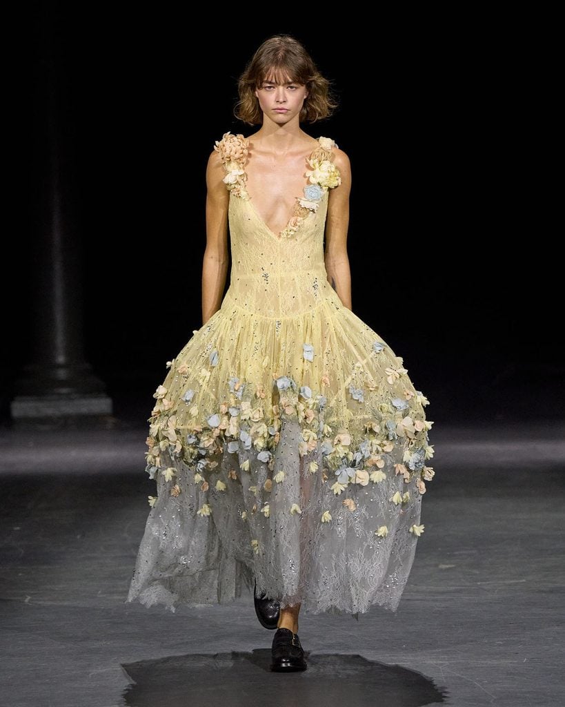Erdem Spring 2027 runway model wearing the yellow and blue lace gown with floral appliqués later worn by Chappell Roan.