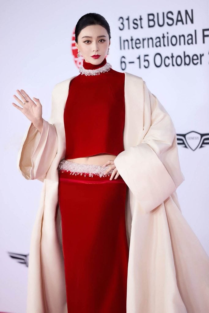 Fan Bingbing wearing Stéphane Rolland Haute Couture with crystal embellishments and an ivory coat at the Busan International Film Festival.