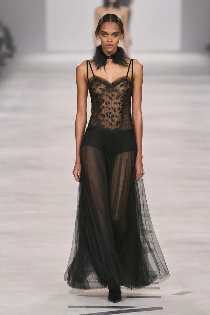 Model wearing a black lace bodice and sheer tulle gown from the Fendi Fall 2026 collection on the runway.