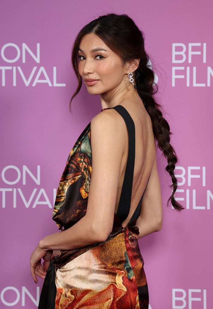 Gemma Chan showing the open back of her Dries Van Noten Fall 2026 printed dress and braided ponytail at the ‘Josephine’ BFI London Film Festival screening.