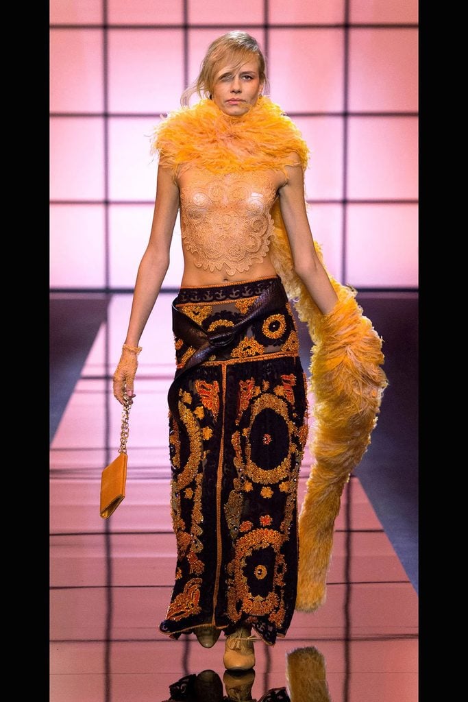 Giorgio Armani Privé Spring 2017 runway look featuring orange feathers, lace and ornate embroidery later worn by Odessa A’zion