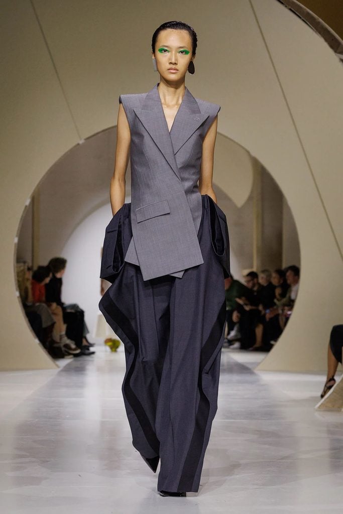 Givenchy Spring 2027 grey slashed sleeveless jacket and dark grey mohair pattern-piece trousers on the runway.