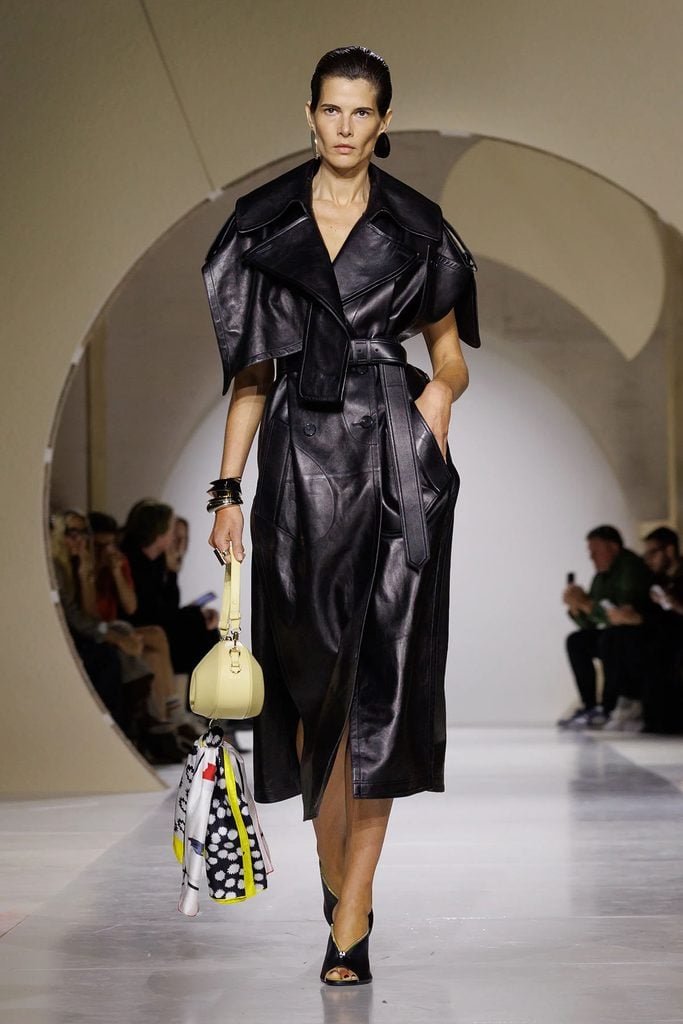 Givenchy Spring 2027 runway model wearing the black leather trench dress later worn by Sarah Paulson in Rome.