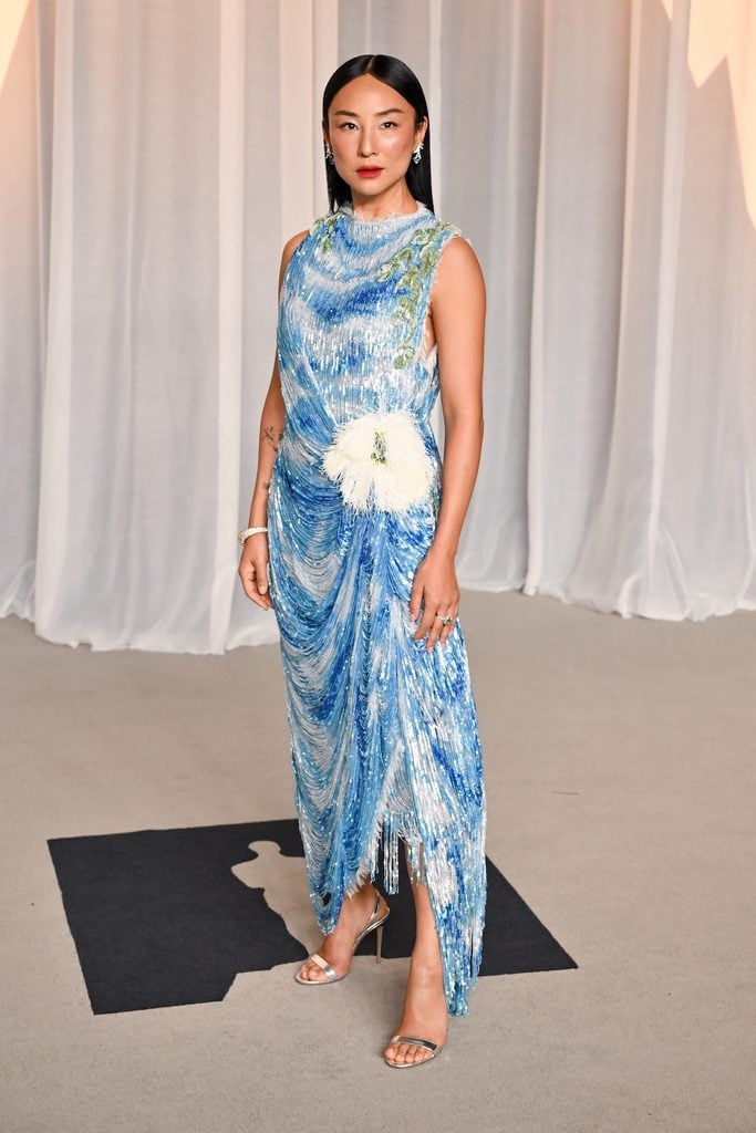 Greta Lee in white Dior Haute Couture with sequin fringe and floral detailing at the Academy Museum Gala