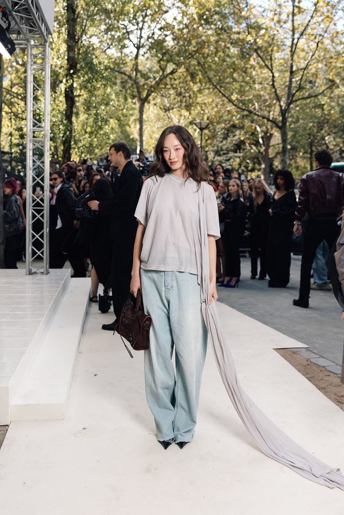 Havana Rose Liu wearing a relaxed Balenciaga look with wide-leg jeans at the Spring 2027 show.