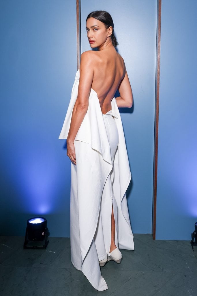 The back of Irina Shayk wearing an ivory Issey Miyake Fall 2026 strapless gown with draped sleeves at the WSJ. Magazine Innovator Awards.