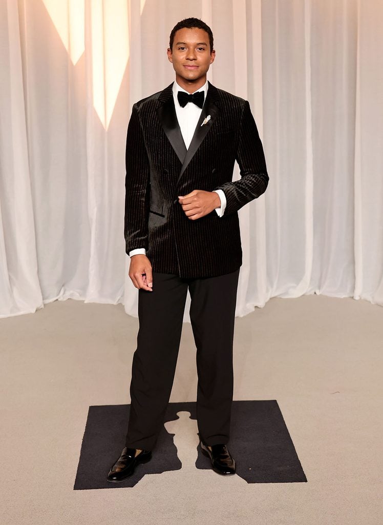 Jaafar Jackson in a black-and-brown velvet Giorgio Armani tuxedo with a Bulgari Serpenti brooch at the 2026 Academy Museum Gala