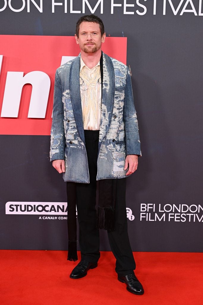Jack O'Connell in a distressed denim Dior Spring 2027 menswear look at the Ink premiere during the BFI London Film Festival