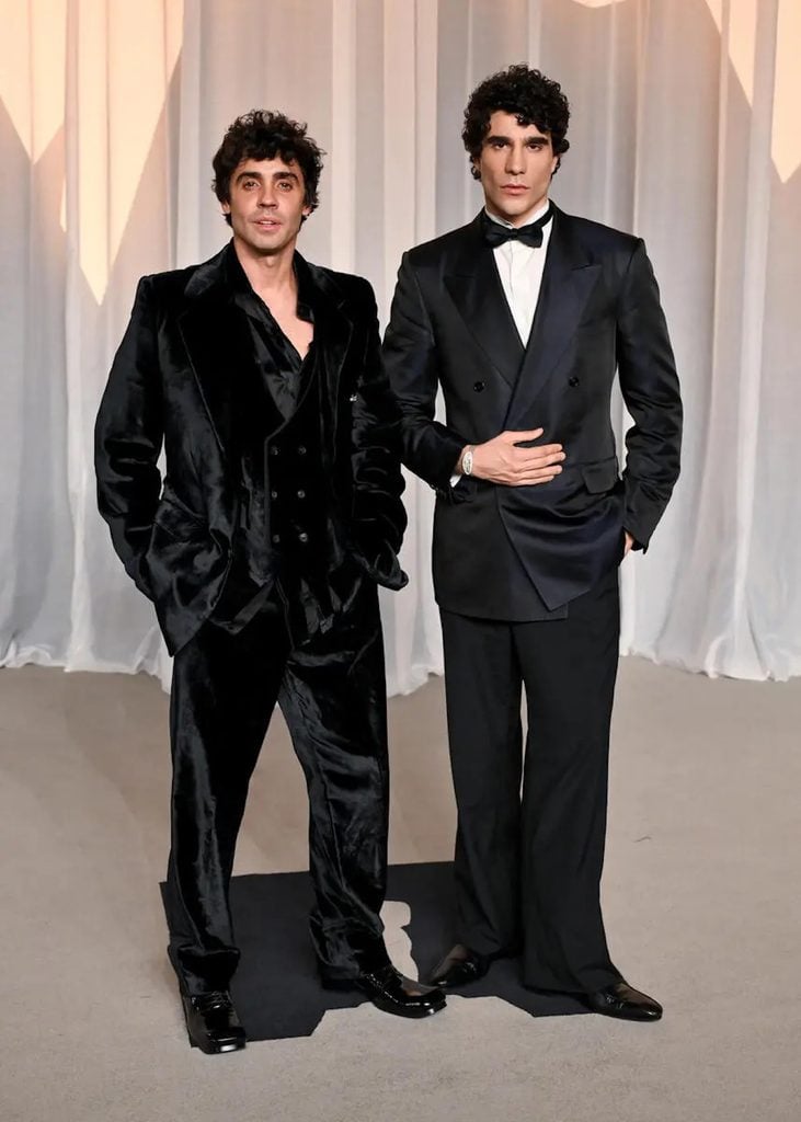 Javier Ambrossi in black velvet alongside Javier Calvo in a Gucci double-breasted tuxedo at the Academy Museum Gala in Los Angeles.