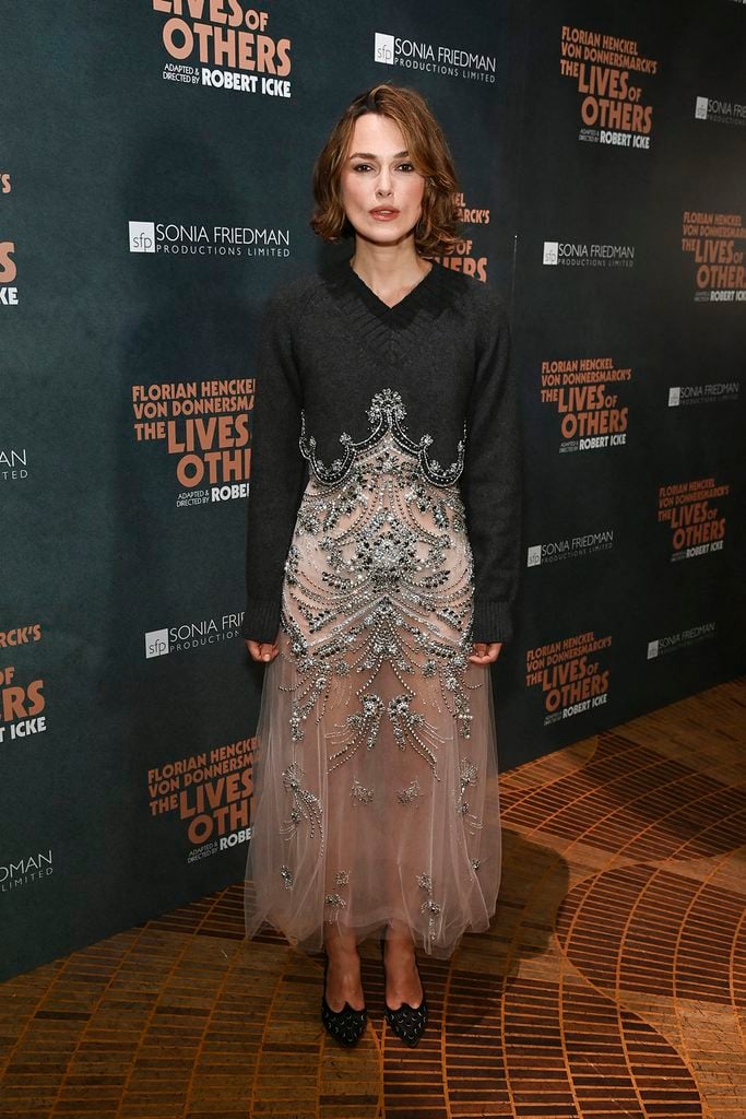 Keira Knightley wears an embellished Erdem Spring 2027 dress with a cropped cashmere sweater at The Lives of Others press night after-party in London.