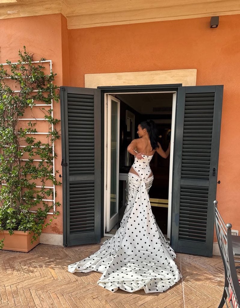 Kim Kardashian posing in her strapless Galia Lahav polka-dot gown at the All's Fair Rome Film Festival photocall