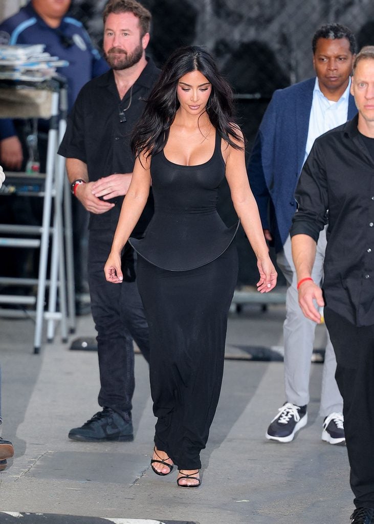 Kim Kardashian wearing a grey Sportmax Spring 2027 fitted dress with a sculptural peplum at ABC Studios for 'Jimmy Kimmel Live!' in Los Angeles
