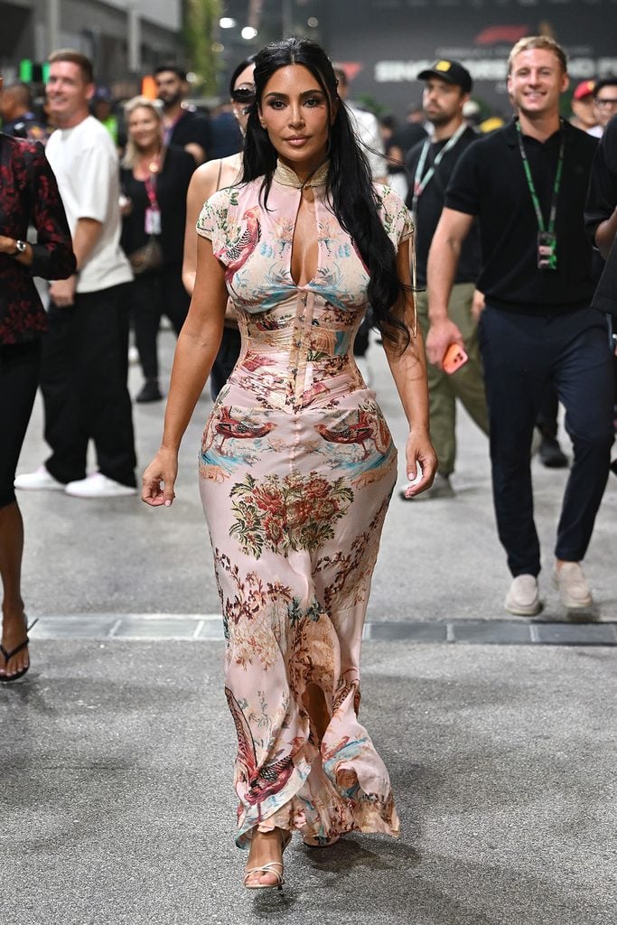 Kim Kardashian wearing a vintage Roberto Cavalli Spring 2003 floral cheongsam dress with a matching corset at the Singapore Grand Prix.