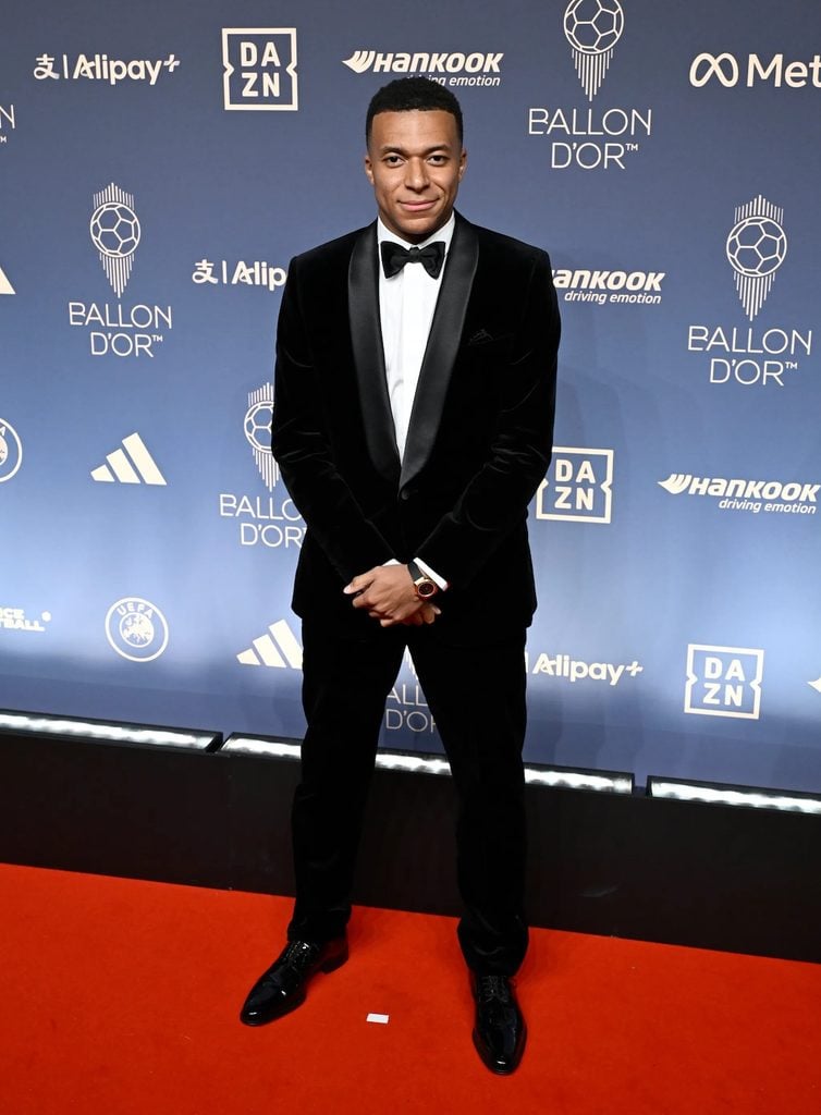 Kylian Mbappé wearing a black velvet Dior shawl-collar tuxedo at the 2026 Ballon d'Or Awards.