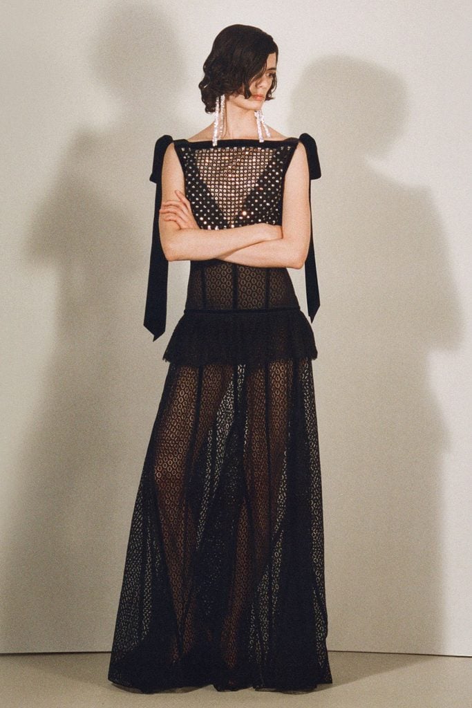 Lanvin Pre-Fall 2026 black openwork gown with velvet shoulder ties on the model.