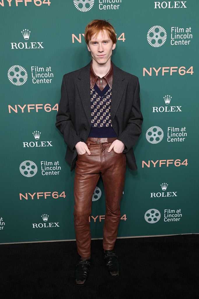 Luther Ford wearing a Prada jacket, patterned knit and brown leather trousers at 'The Man I Love' premiere during the 2026 New York Film Festival.