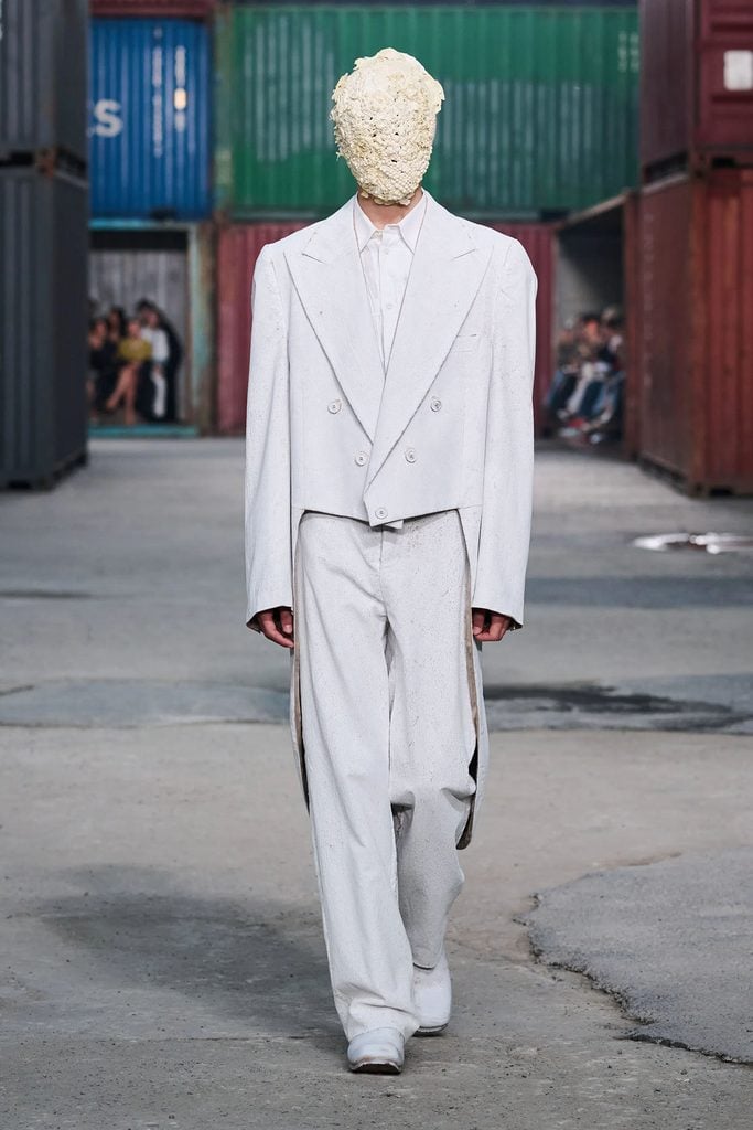 Maison Margiela Fall 2026 runway model wearing the white Bianchetto-painted Edwardian-inspired suit later worn by Morgan Spector.