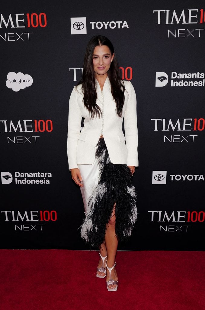 Marisa Abela pairs a fitted ivory Dior jacket with a black-and-white feathered skirt and Dior Rose sandals at the TIME100 Next Gala.
