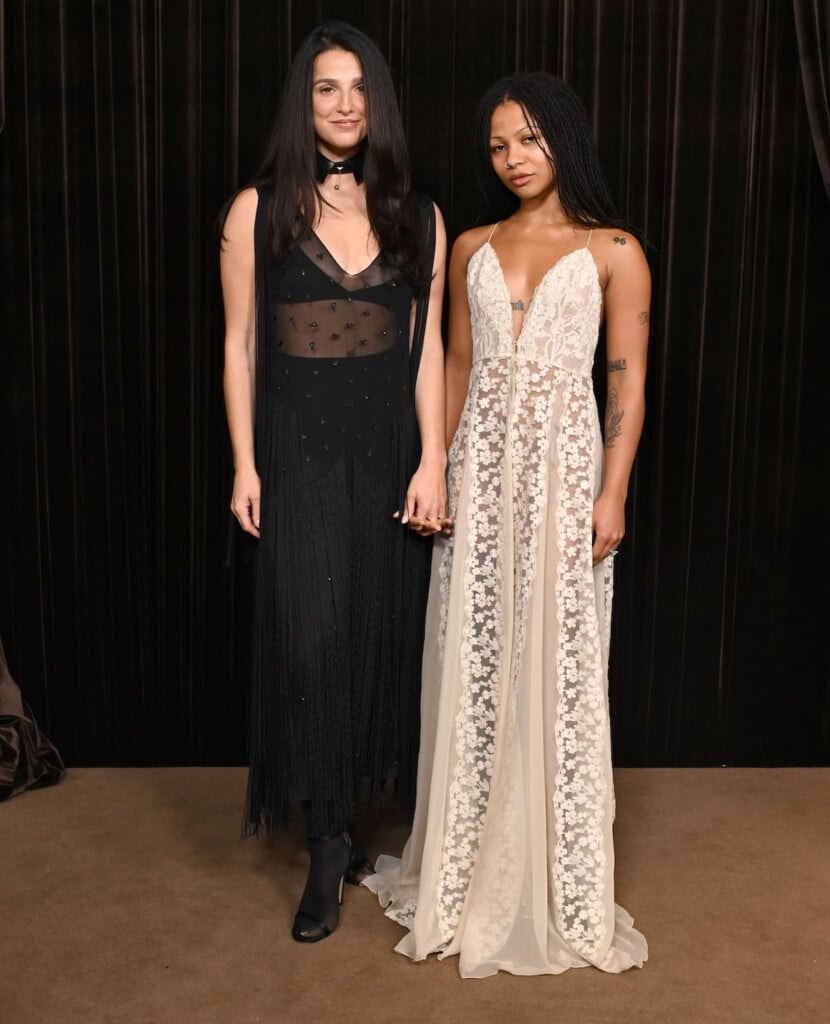 Myha’la Herrold in an ivory lace Fendi gown and Marisa Abela in a black fringed Fendi dress at the 2026 Albies in London.