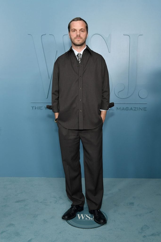 Chanel artistic director Matthieu Blazy wears a dark button-front shirt, relaxed trousers and a striped tie at the 2026 WSJ. Magazine Innovator Awards in New York.