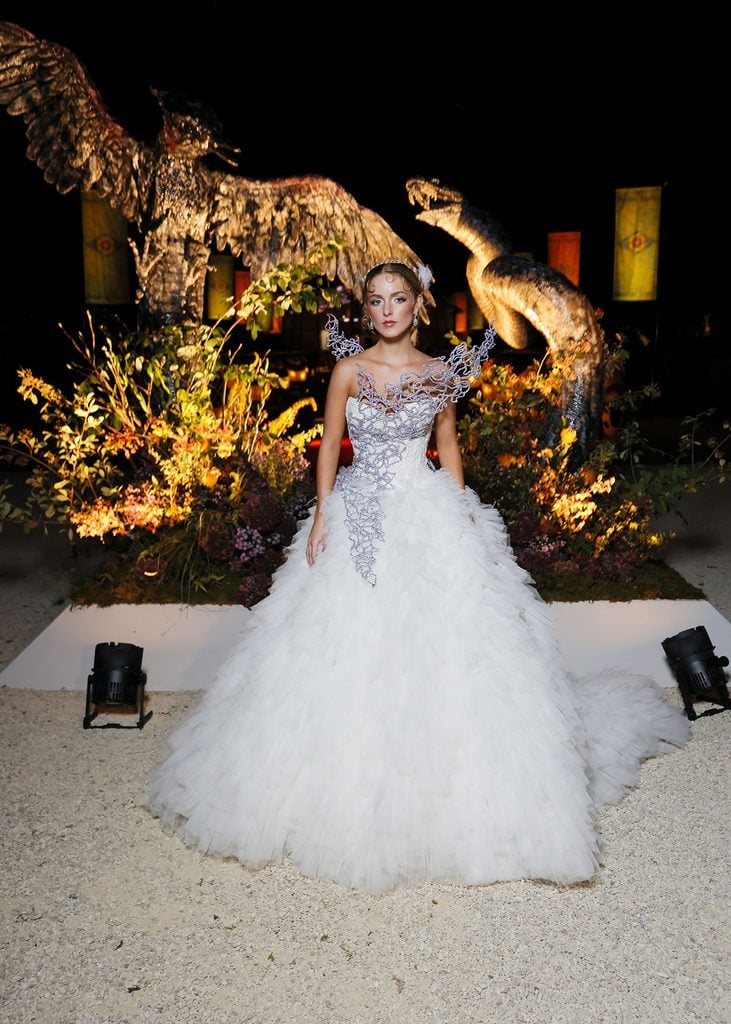 Mckenna Grace wearing a white Monique Lhuillier gown at the Hunger Games Elegance Is Authority event at Musée Rodin in Paris.