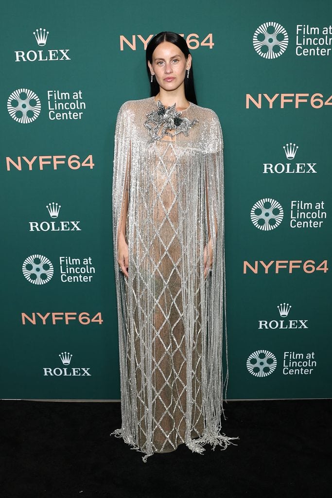 Milena Smit wearing an embellished silver Valentino Resort 2027 dress with shimmering fringe at the 'Bitter Christmas' premiere.