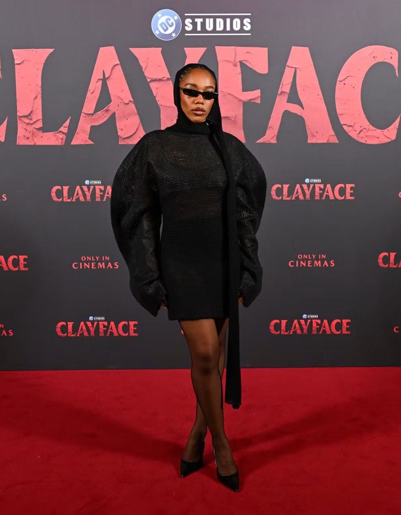Naomi Ackie wears a sculptural black Issey Miyake Fall 2026 knitted mini dress with Paris Texas slingback pumps at the Clayface London screening.