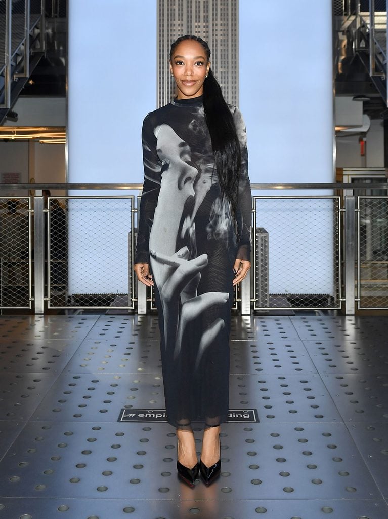 Naomi Ackie wears a Jean Paul Gaultier Smoking Graphic mesh bodycon dress during a Clayface promotional visit to the Empire State Building in New York.