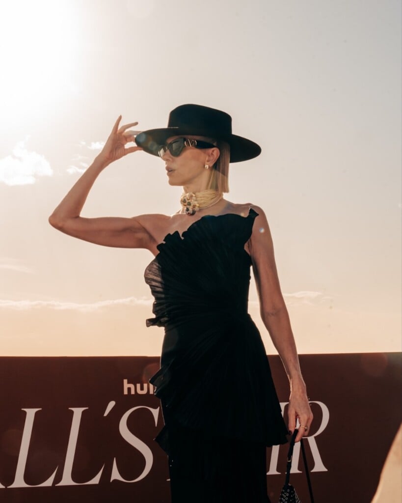 Naomi Watts in Valentino black pleated dress, hat and statement necklace in Rome.