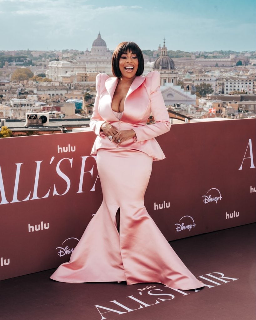 Niecy Nash wearing a pink Diarbakerli Jozeph & Cintia Spring 2027 satin ensemble at the All's Fair Rome photocall.