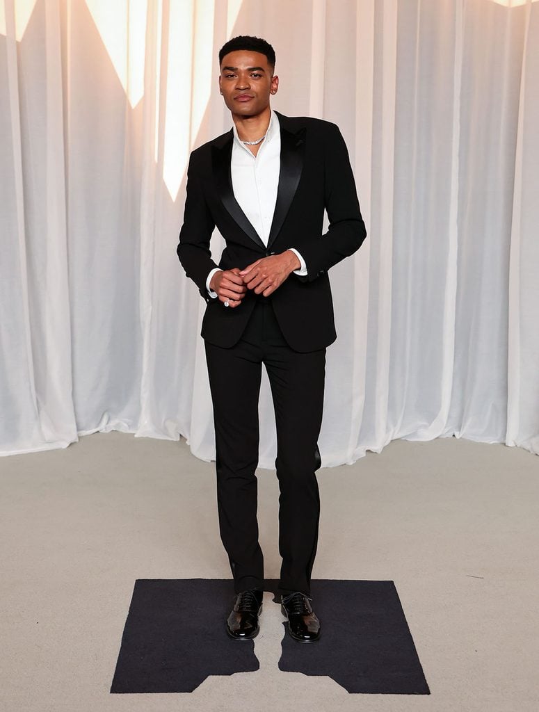 Owen Thiele in a slim-cut black Giorgio Armani tuxedo with jewellery at the 2026 Academy Museum Gala in Los Angeles