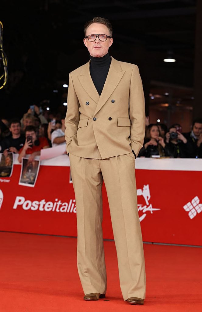 Paul Bettany in a camel double-breasted suit with a black roll-neck at the 'Visionquest' premiere in Rome