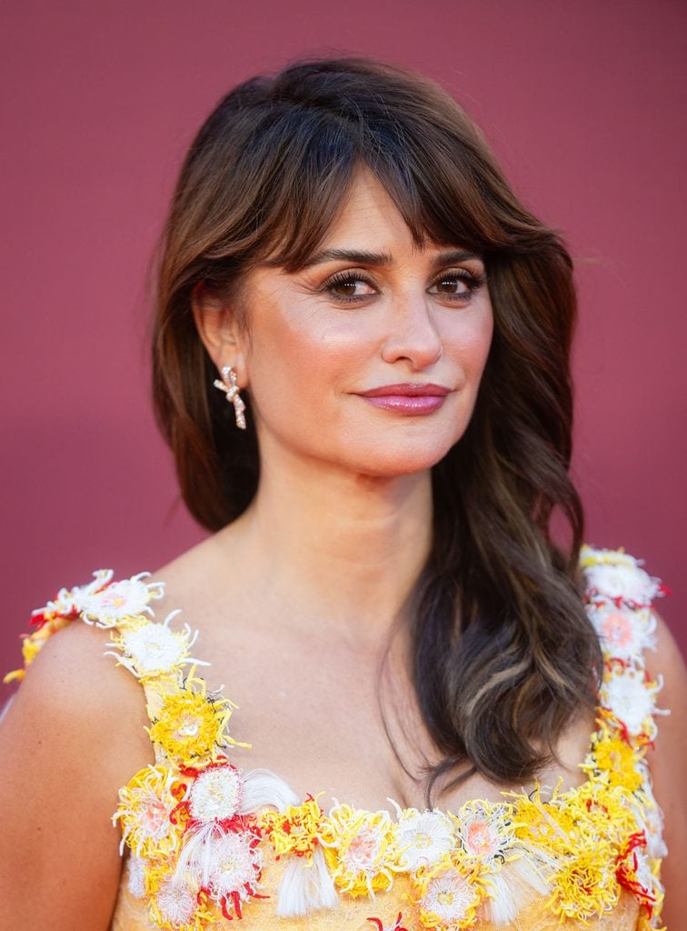 Close-up of Penélope Cruz wearing Chanel High Jewellery Ruban earrings with her floral-embroidered Chanel gown at the 2026 BFI London Film Festival