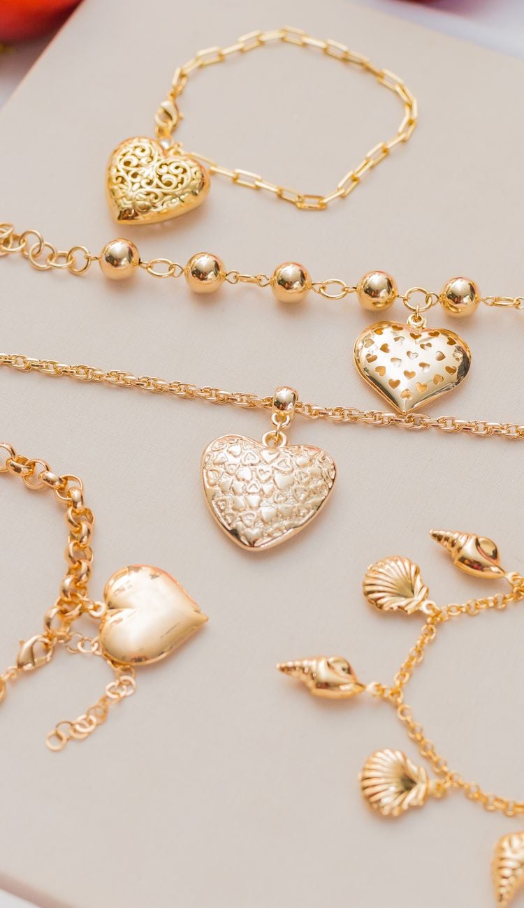 elegant gold jewelry with heart pendants display