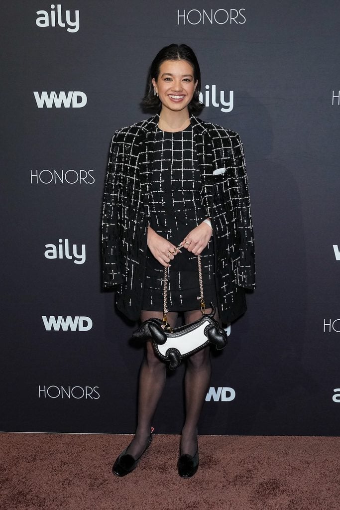 Peyton Elizabeth Lee at the 2026 WWD Honors carrying a dog-shaped Thom Browne Hector bag with her coordinated tailoring.