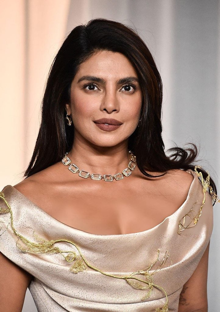 Priyanka Chopra wearing a champagne Vivienne Westwood Couture gown at the 2026 Academy Museum Gala with Goshwara earrings and a necklace, along with a Leviev ring.