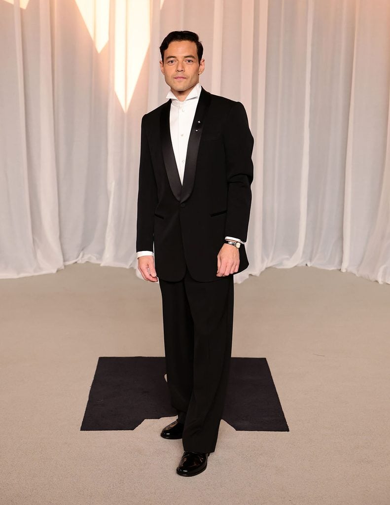 Rami Malek wearing a classic black Giorgio Armani tuxedo and wing-collar shirt at the 2026 Academy Museum Gala in Los Angeles