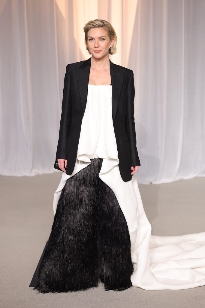 Rhea Seehorn wearing a black Balenciaga jacket, white draped top and textured black trousers at the 2026 Academy Museum Gala