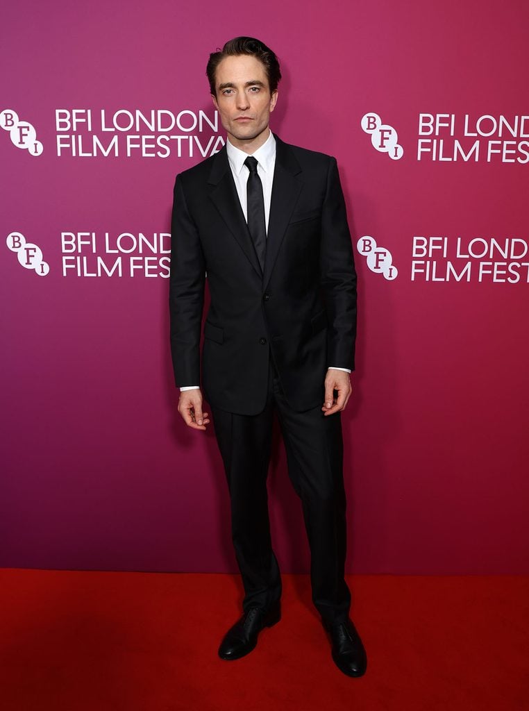 Robert Pattinson wearing a black Dior wool suit, white shirt and black tie at the 'Primetime' BFI London Film Festival premiere.