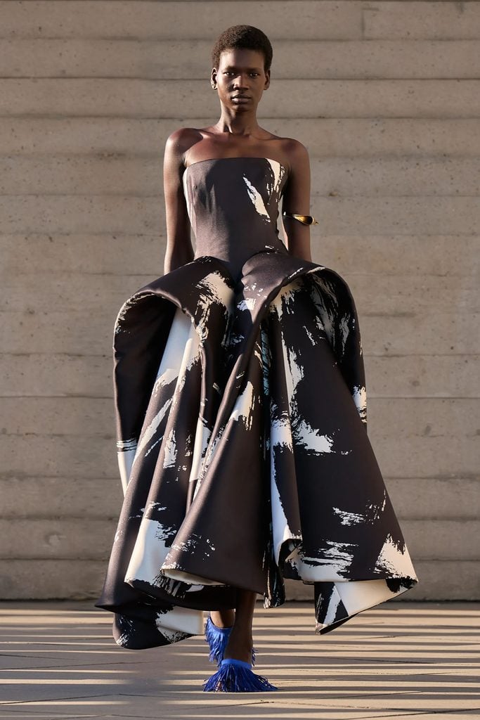 Roksanda Spring 2027 runway model wearing the black-and-white sculptural gown later seen on Naomi Watts in Rome.